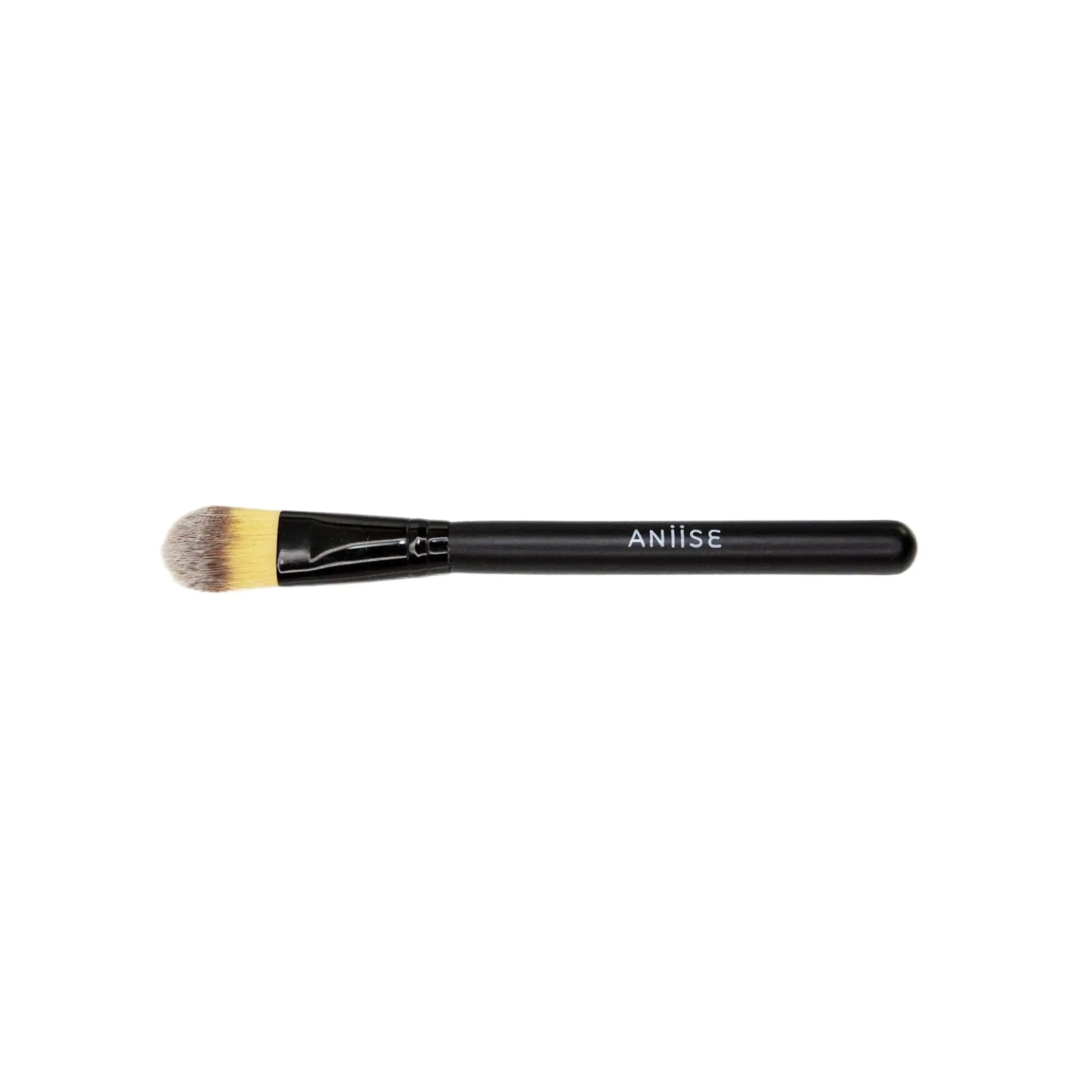 Makeup brush with black handle and gold ferrule on a white background