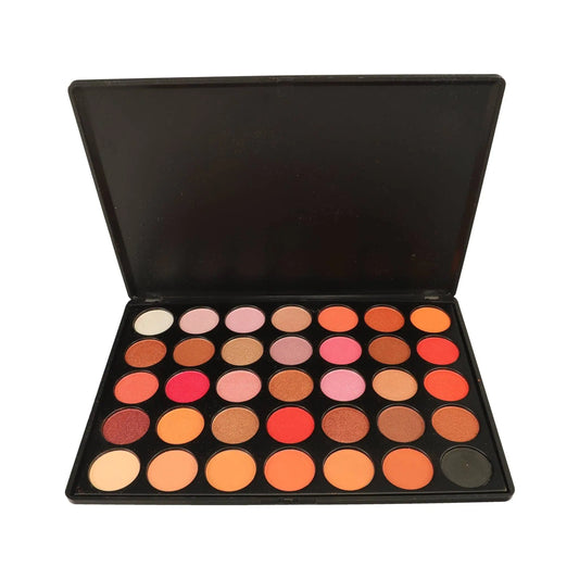 Makeup palette with various colors on a white background