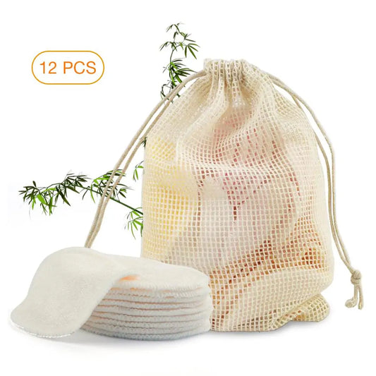 Drawstring bag with cotton pads and a branch of bamboo on a white background