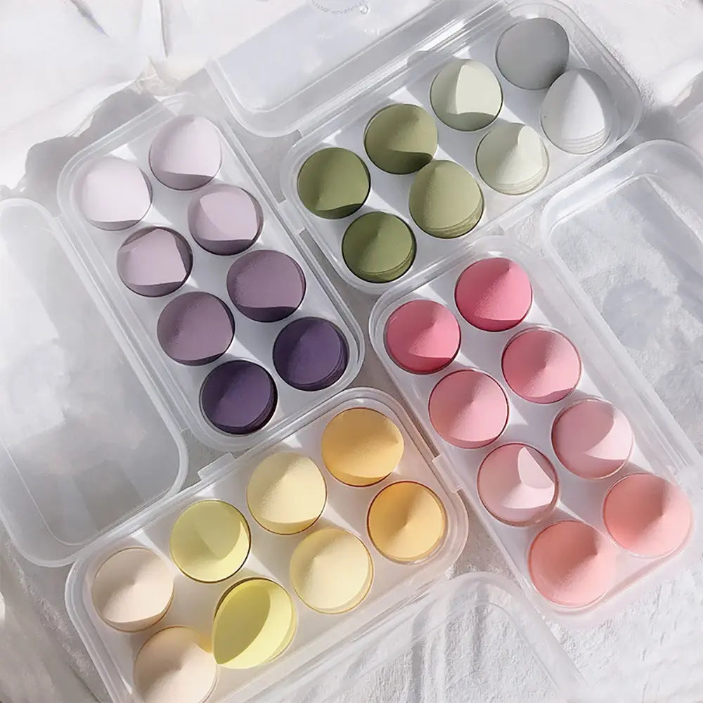 Set of pastel-colored ice cube trays on a light background