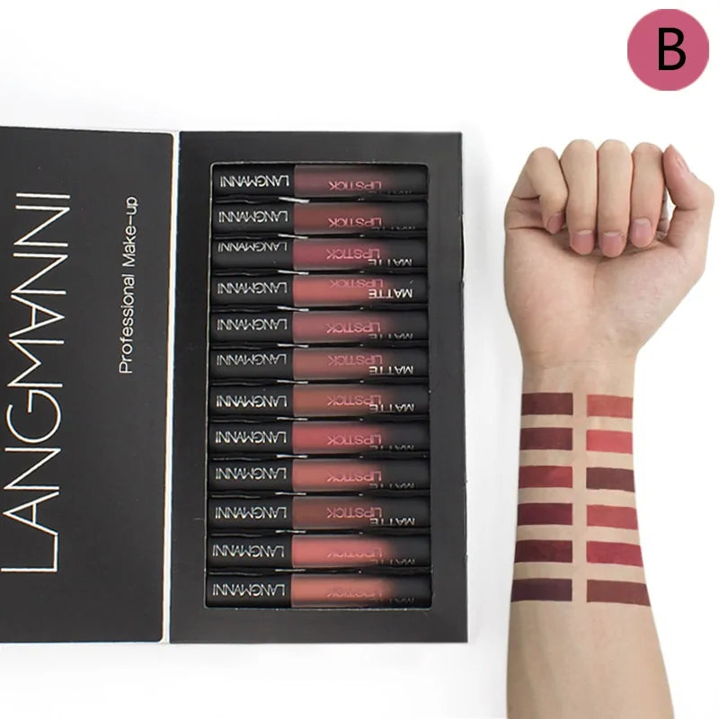 Set of Langmanini lipsticks with a box and arm swatches on a white background