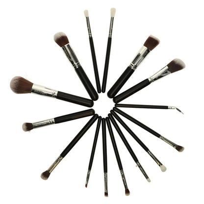 Set of makeup brushes arranged in a circular pattern on a white background