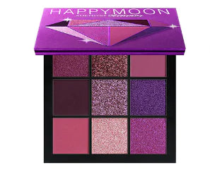 Makeup palette with purple and pink shades on a white background