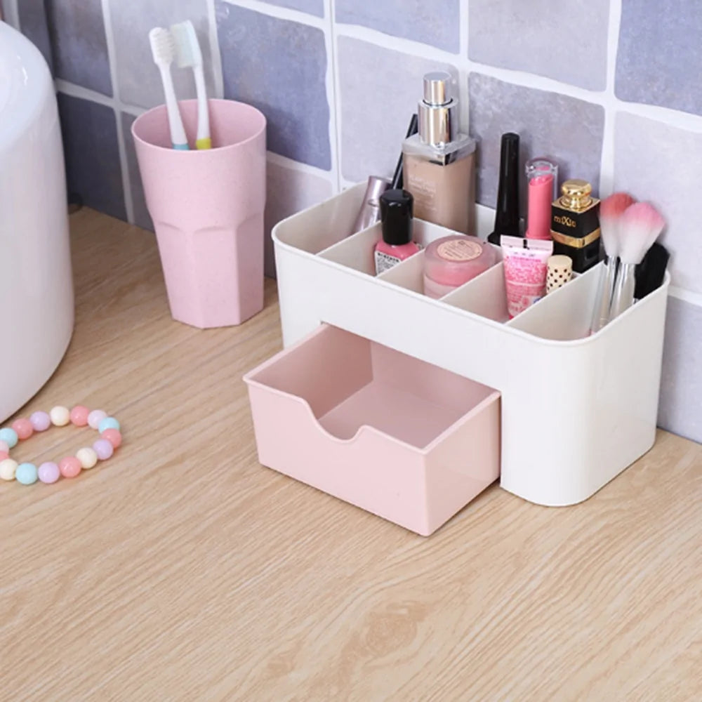 Bathroom counter with a white and pink storage caddy holding various items.