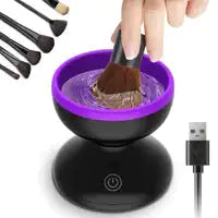 Makeup brush cleaning device with brushes, bowl, and USB cable on a white background