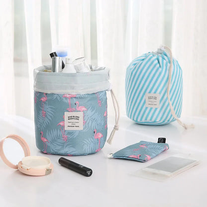 Two blue drawstring bags with flamingo patterns on a white surface.