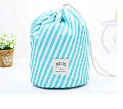 Blue and white striped drawstring bag on a light gray background