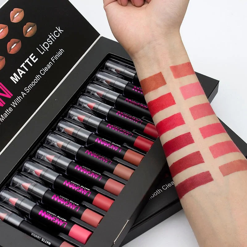 Set of NUXE matte lipsticks with swatches on a arm