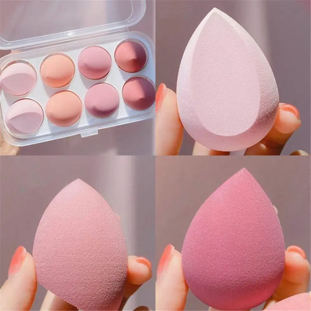 Makeup sponges and color swatches in a compact case.