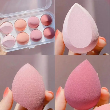 Makeup sponges and color swatches in a compact case.