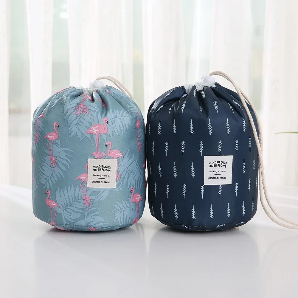 Two drawstring bags, one with flamingo pattern and the other with leaf pattern, on a light background.